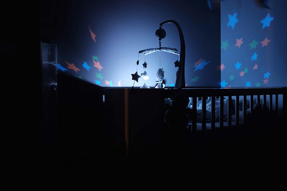 baby's crib, nightlight and mobile. Photo by Bastien Jaillot